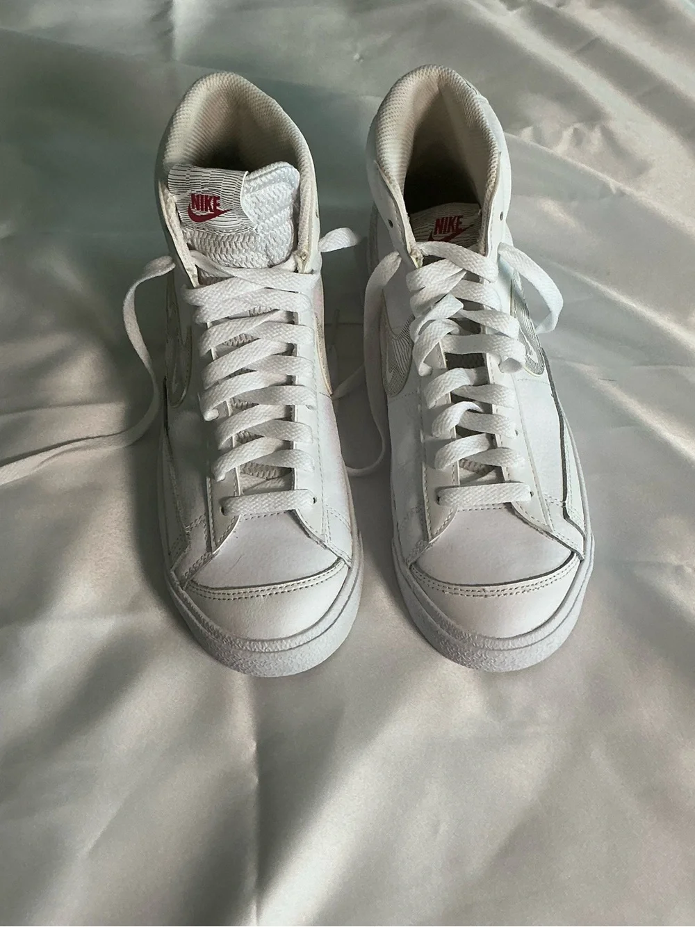 Nike White High-Top Sneakers with Red Logo